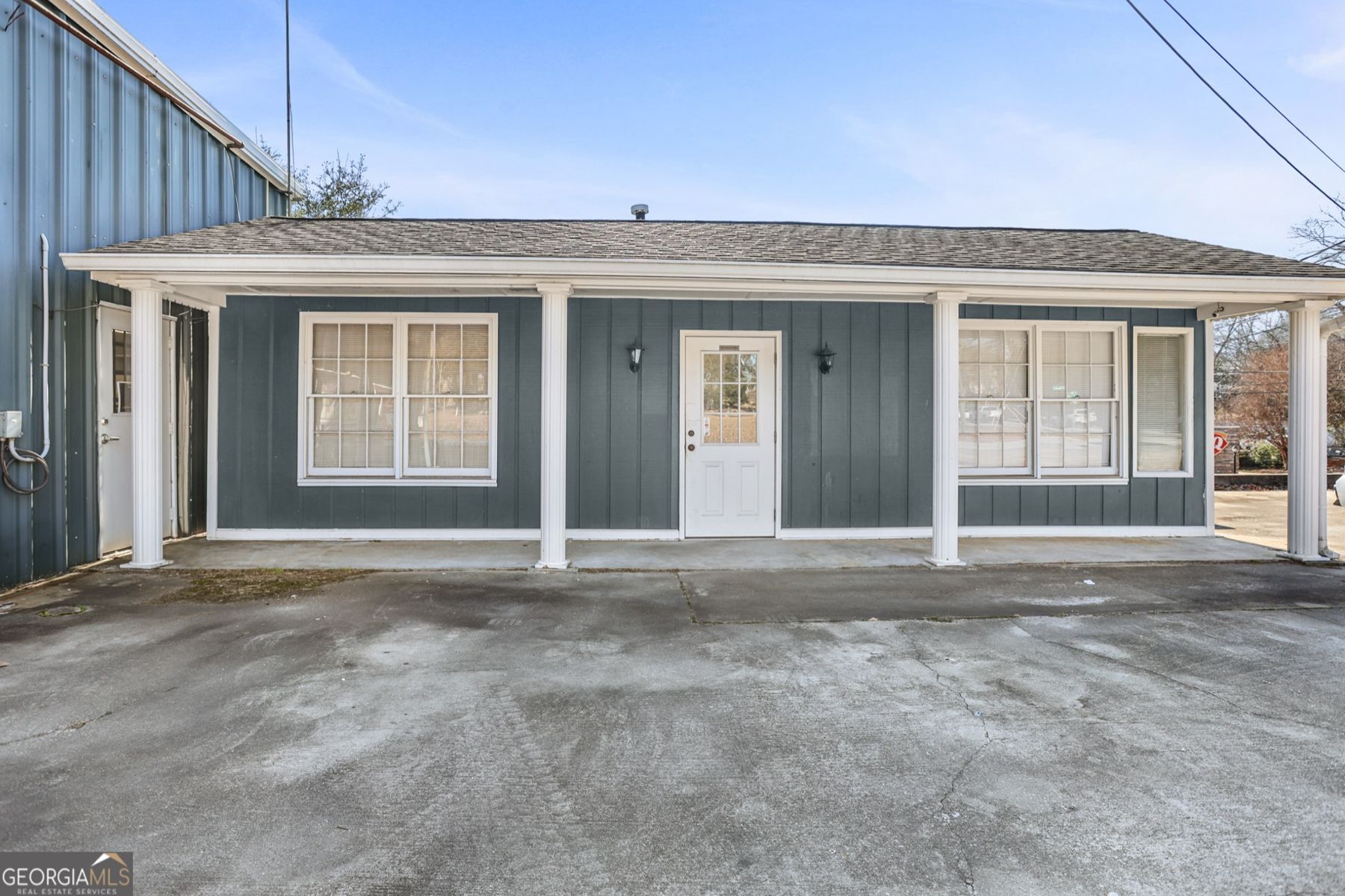 Front of the building with covered porch, 65 A Jefferson St, Newnan, GA