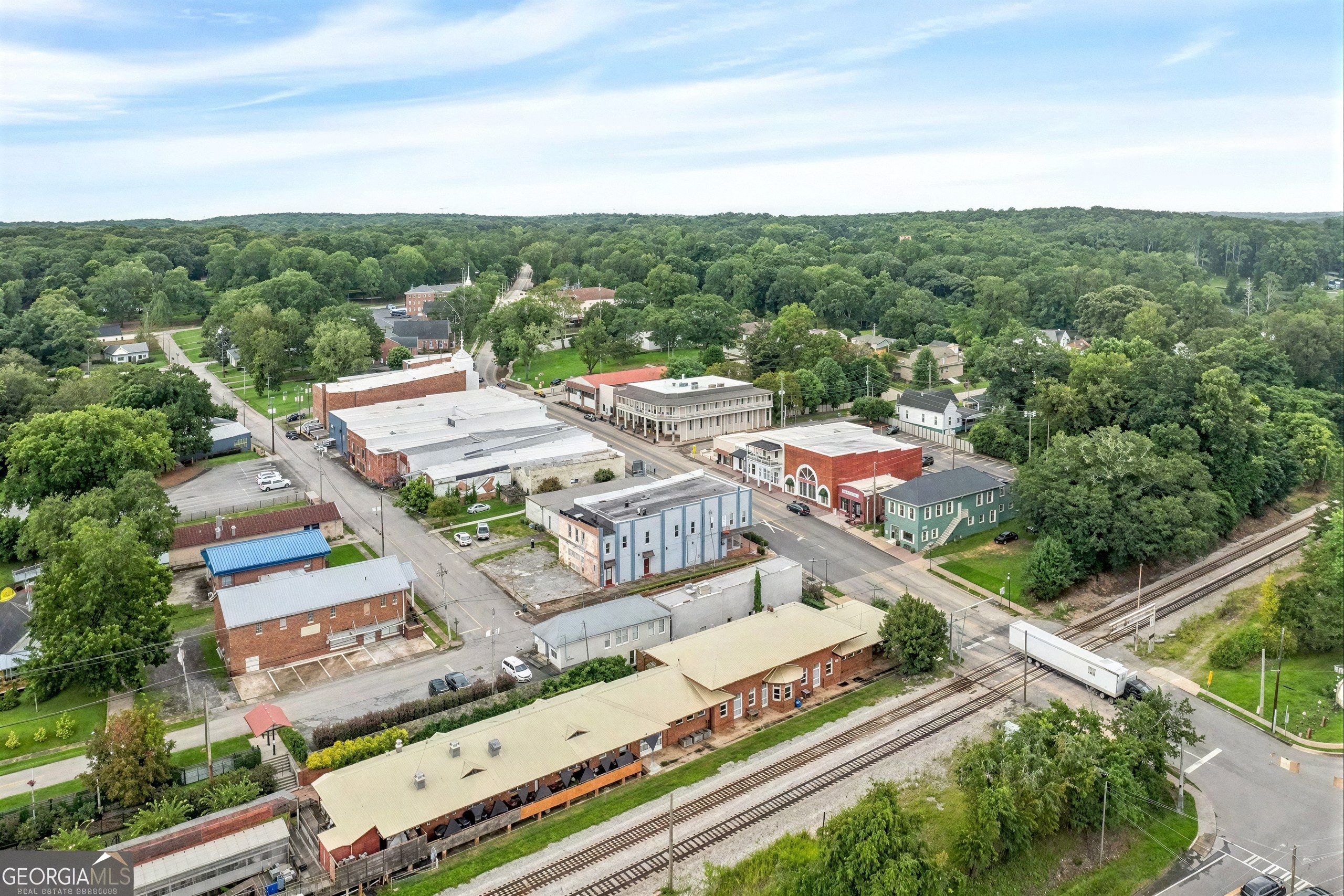 Aerial view of downtown Hogansville, GA beside the railroad tracks